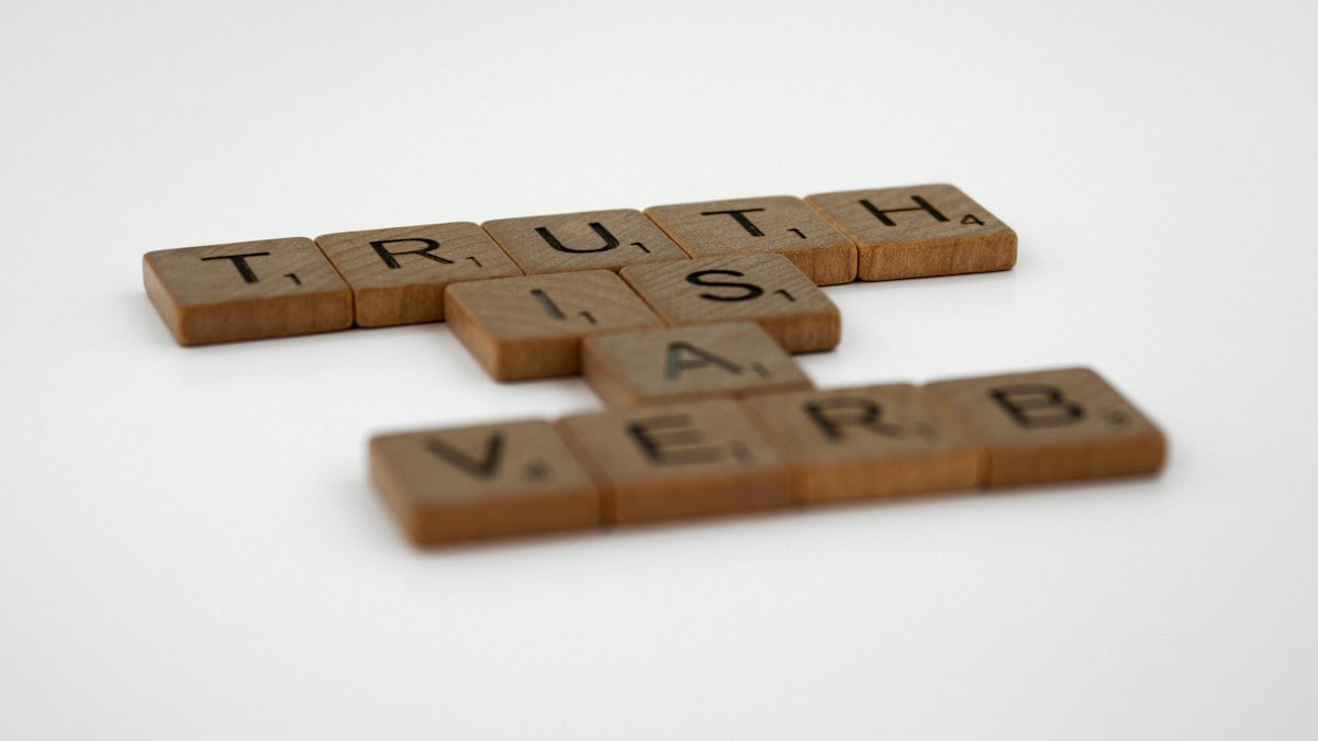 scrabble, scrabble pieces, lettering, letters, wood, scrabble tiles, white background, words, quote, letters, type, typography, design, layout, focus, bokeh, blur, photography, images, image, truth, truth is a verb, verb, true, tell the truth, live the truth, verity, integrity, honesty, ethics, ethical, mindfulness, love, honour, veracity, righteousness, gospel, christian, christ, jesus,